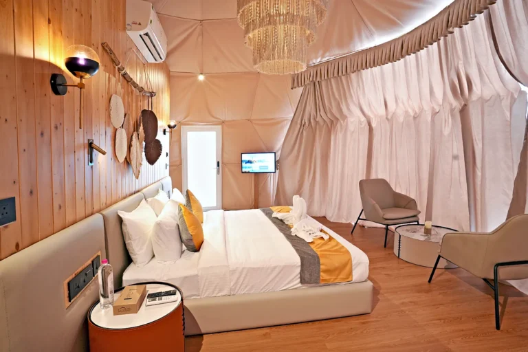 Dome suite bedroom curtains – Le Villagio Resort & Domes, Wayanad