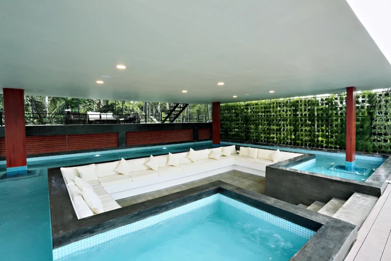 Island pool with sunken seating in the water, Le Villagio