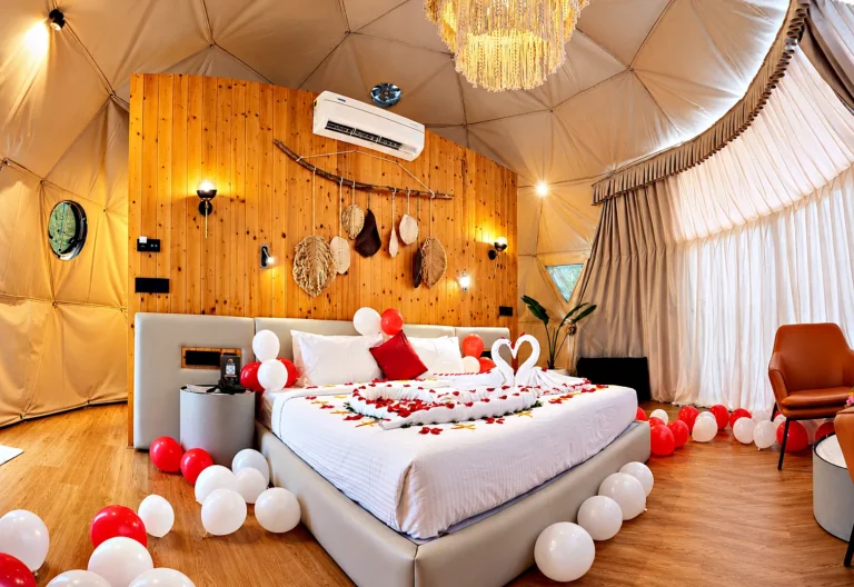 Romantic dome retreat with swan towels and balloon decor