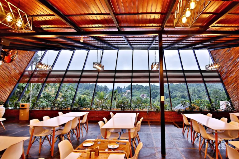 Rooftop restaurant hill view – Le Villagio Resort & Domes, Wayanad