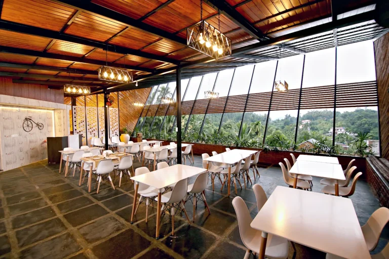 Rooftop restaurant seating – Le Villagio Resort & Domes, Wayanad